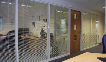 Typical glazed partition with blinds.